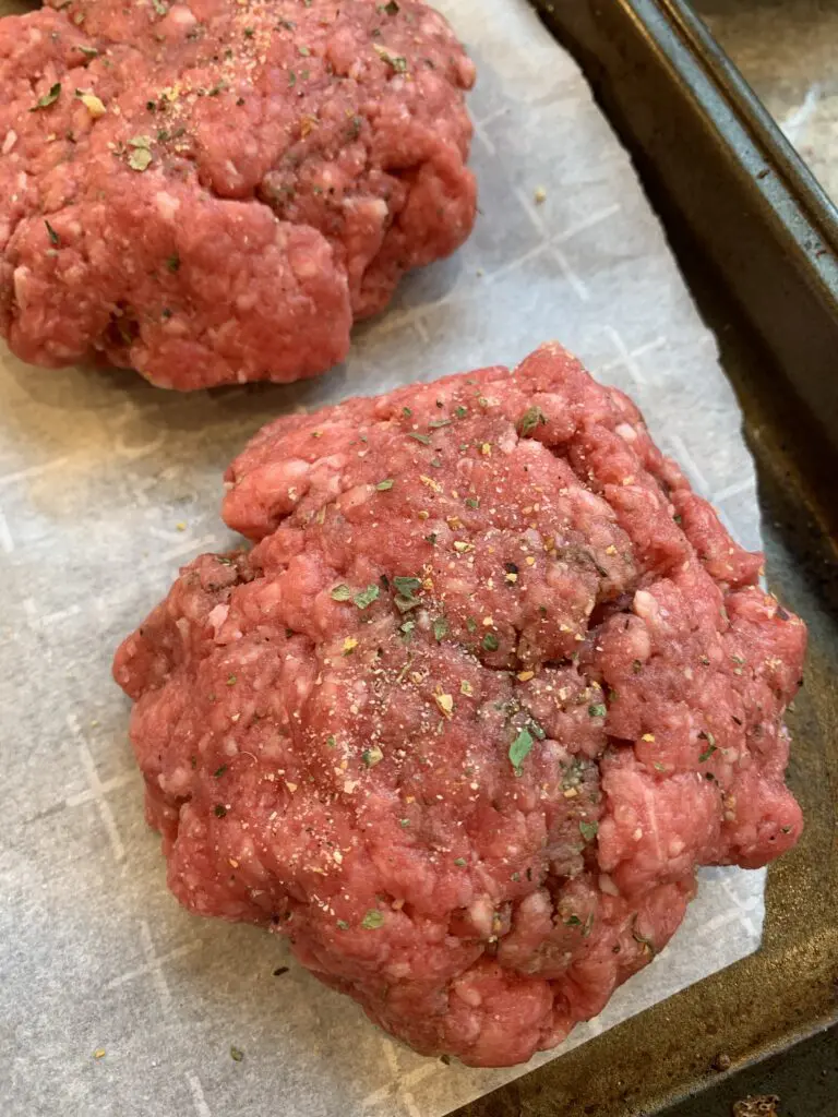 burger patties on parchment paper