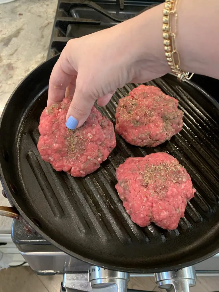 cooking burgers on a grill pan