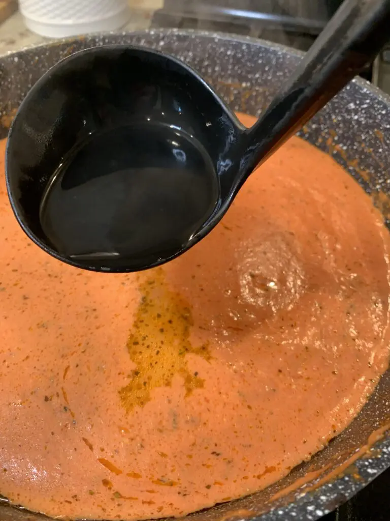 pasta water going into tomato sauce