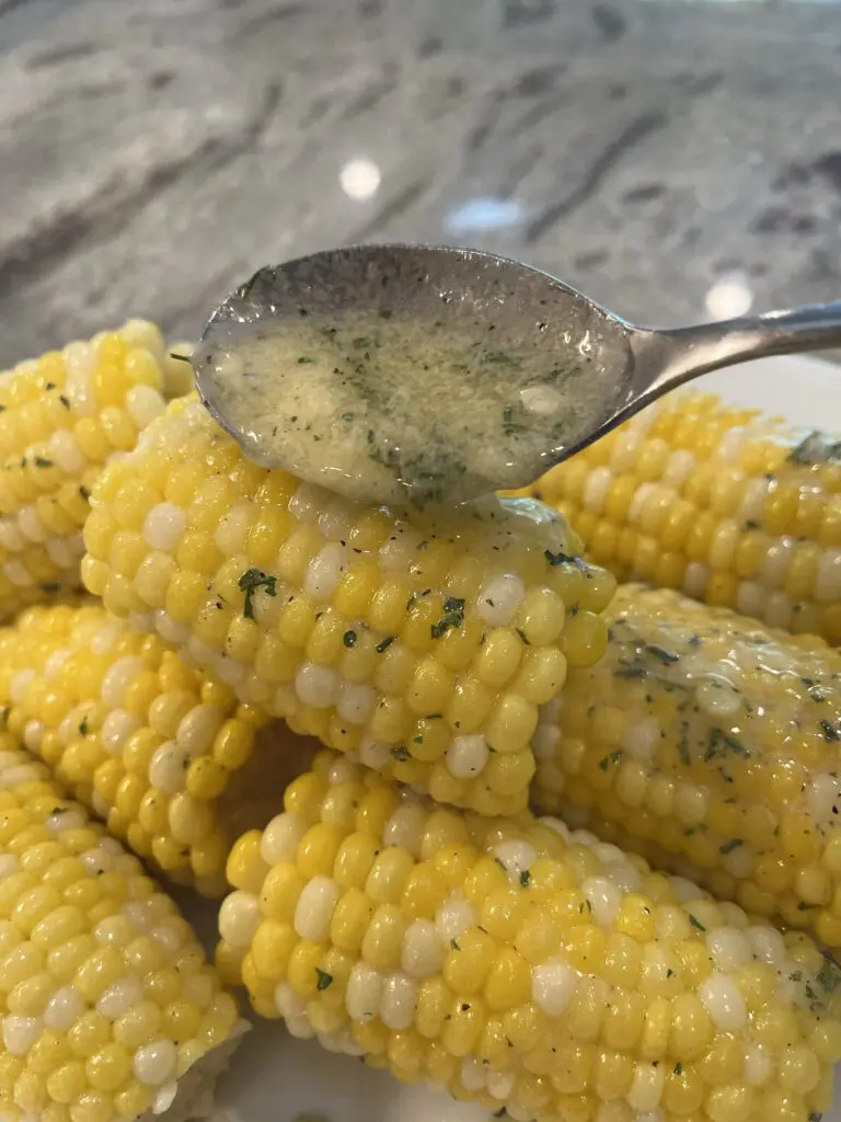 ranch butter spooned over corn