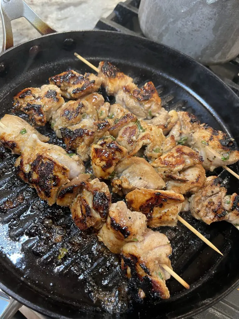 cooking the chicken skewers