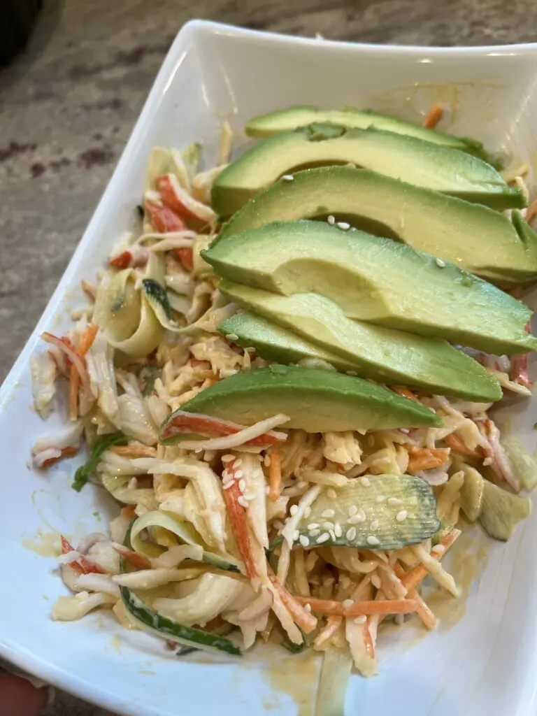 spicy kani salad with sesame seeds and avocado