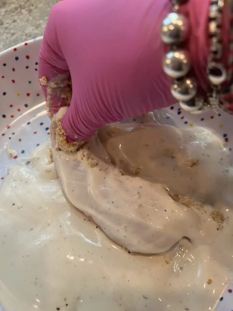 dipping chicken into ranch