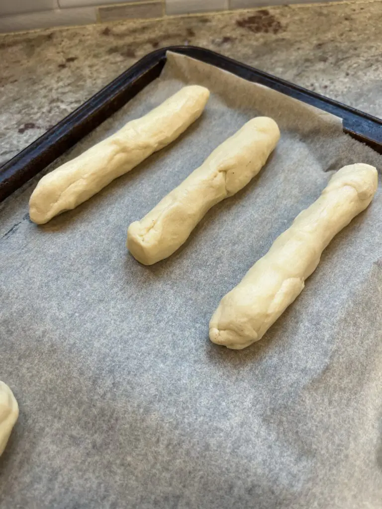 string cheese and crescent rolls on baking sheet