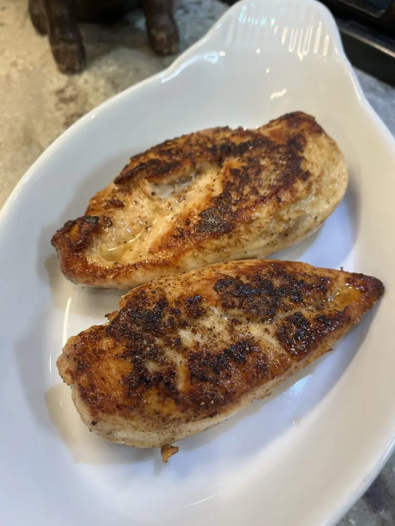 cooked chicken breast set aside
