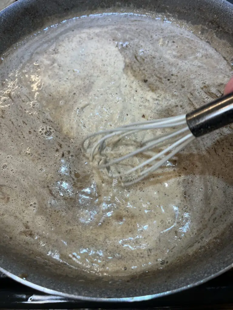 whisking the pan sauce