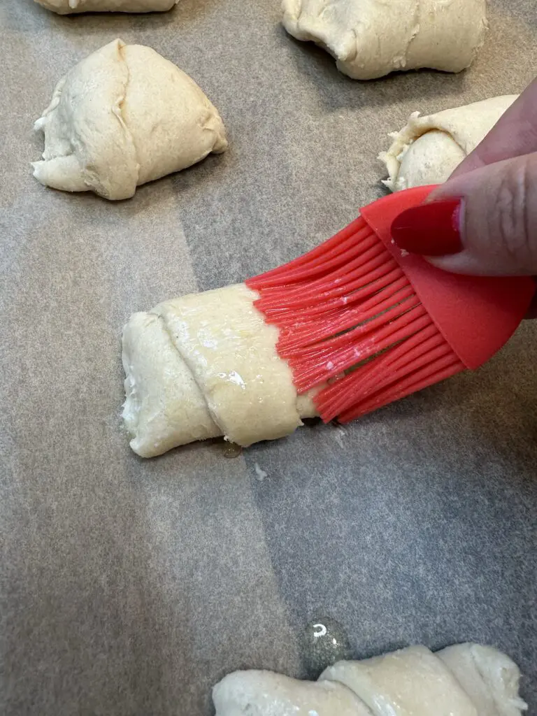 brushing tops with butter