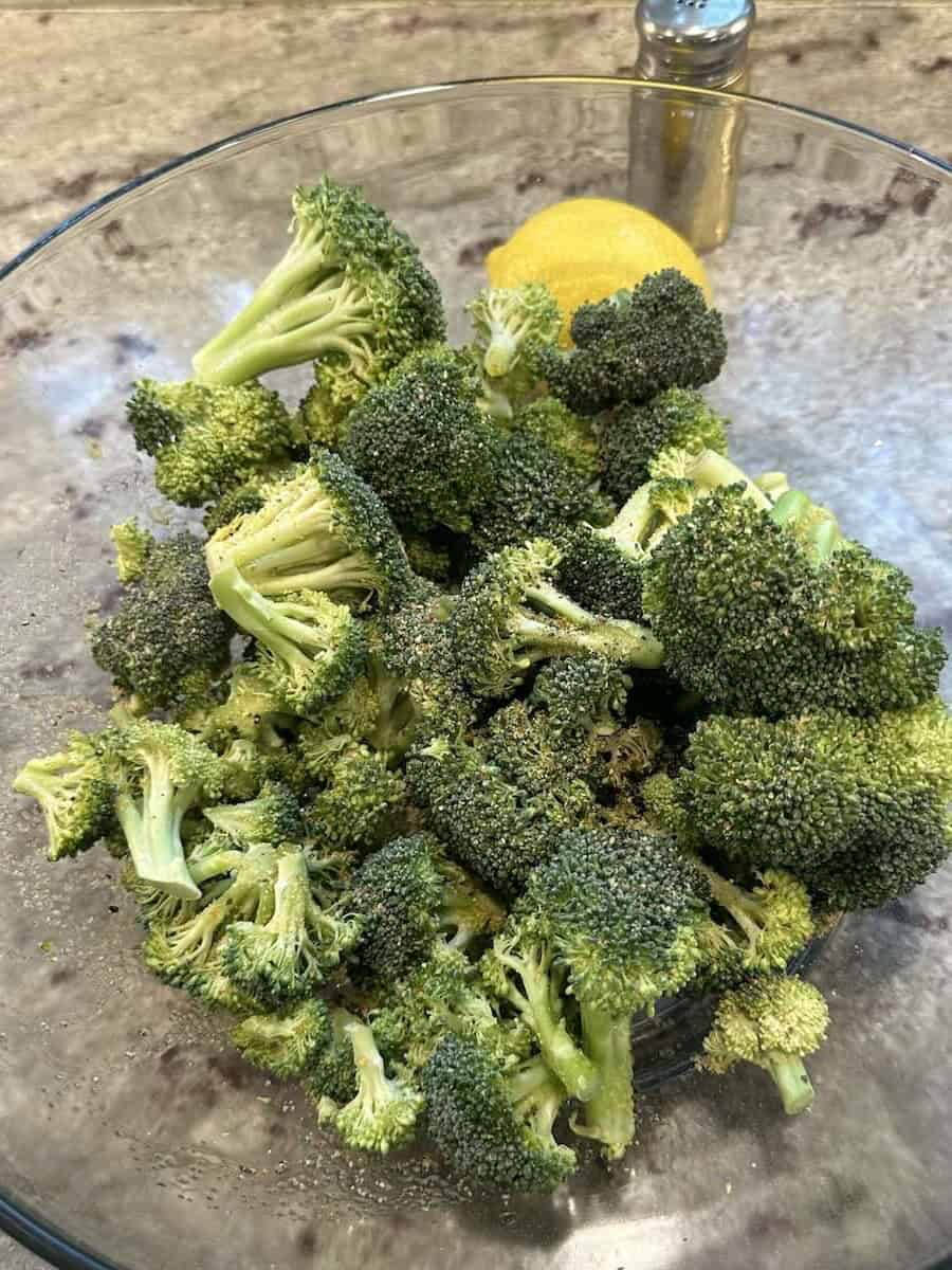 broccoli florets in a blow with seasoning