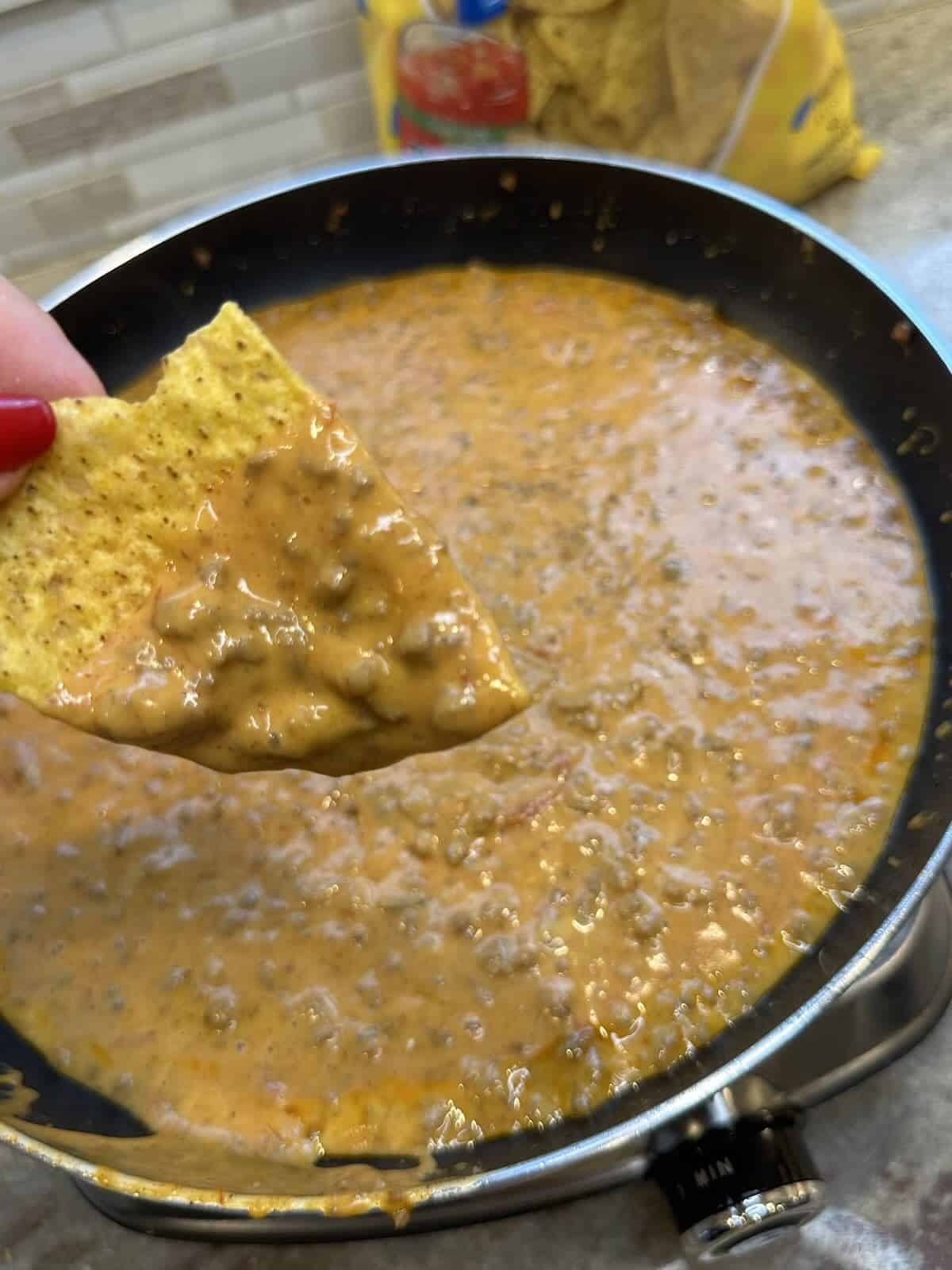 finished beef queso in skillet