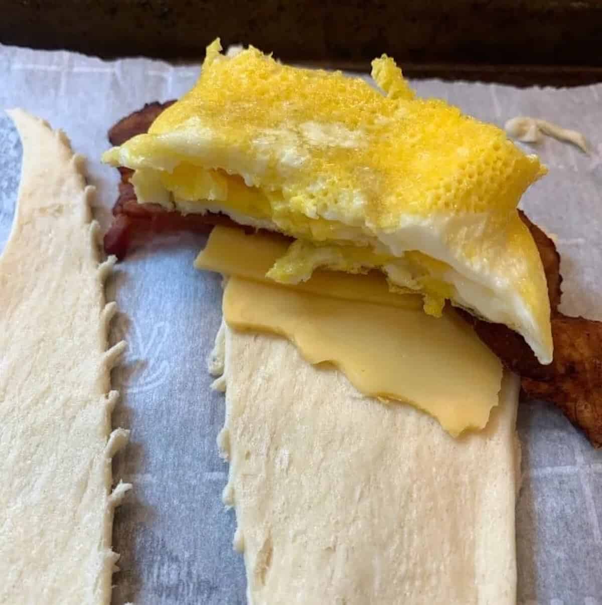 bacon egg and cheese in crescent roll dough