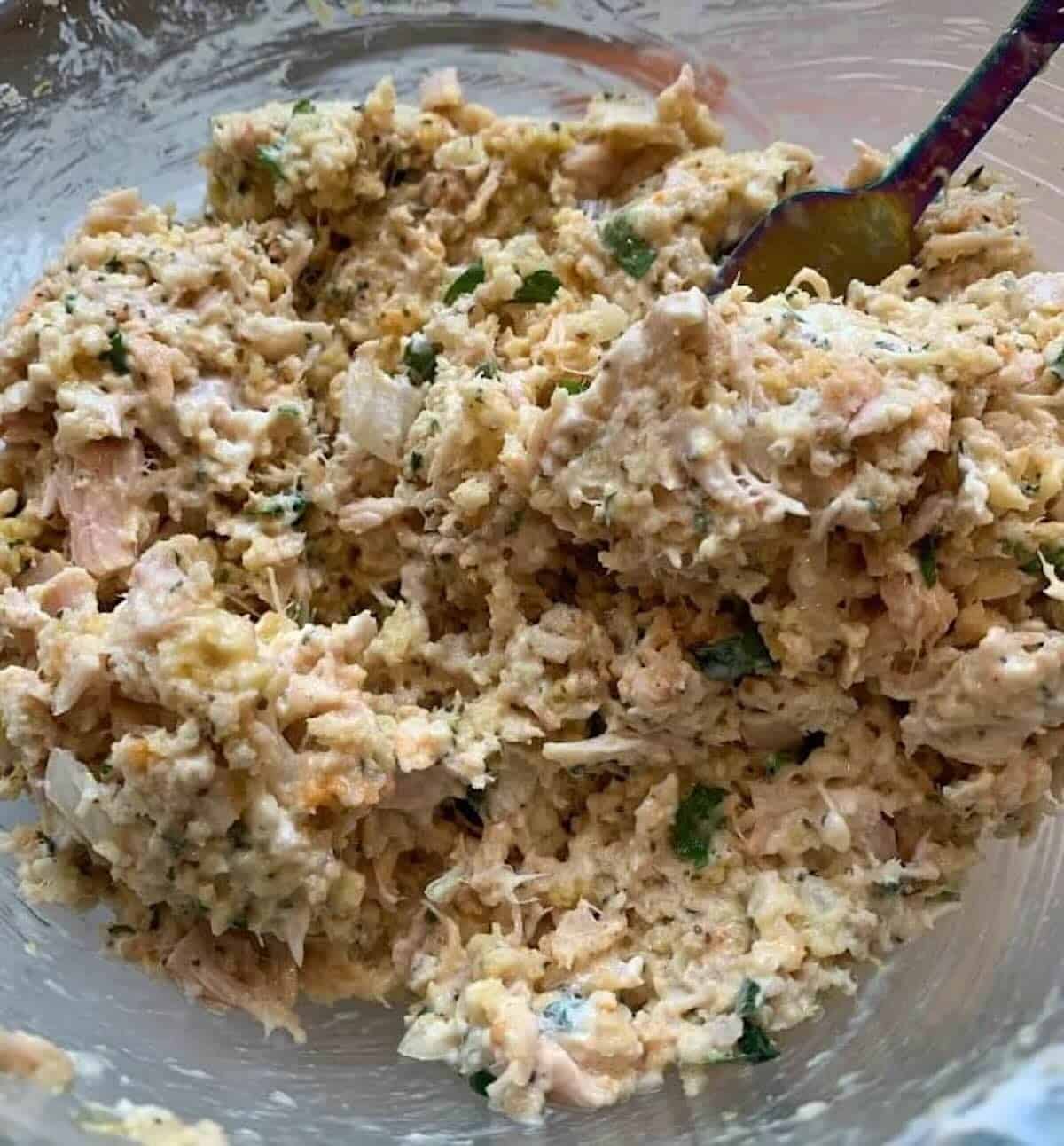canned tuna cake ingredients mixed in a bowl