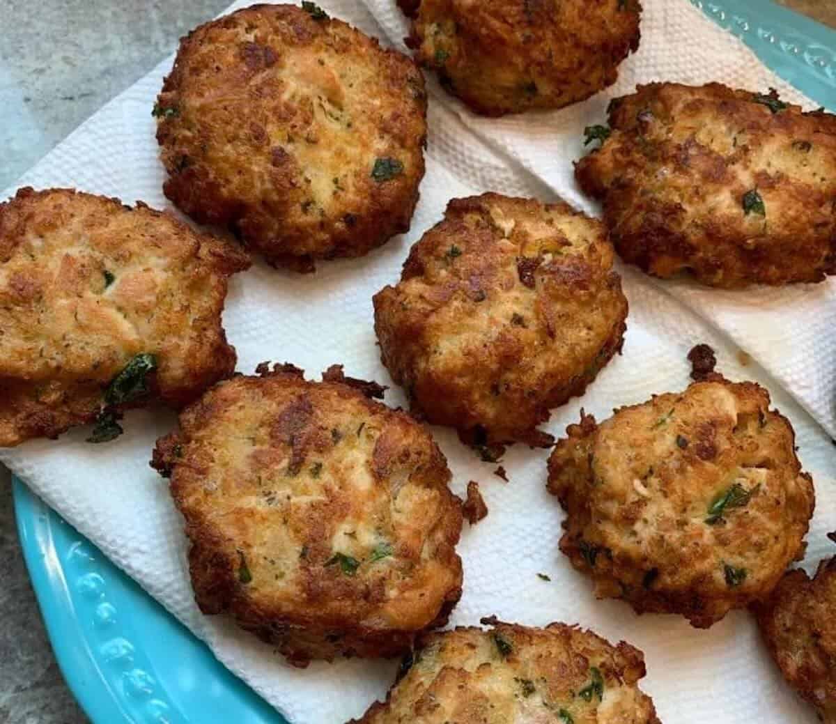 fried tuna cakes draining on paper towels