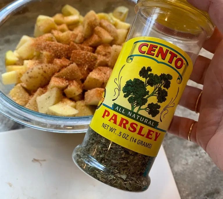 adding parsley to potatoes