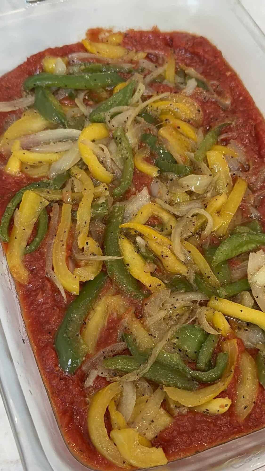 sauted peppers and onions in baking dish.