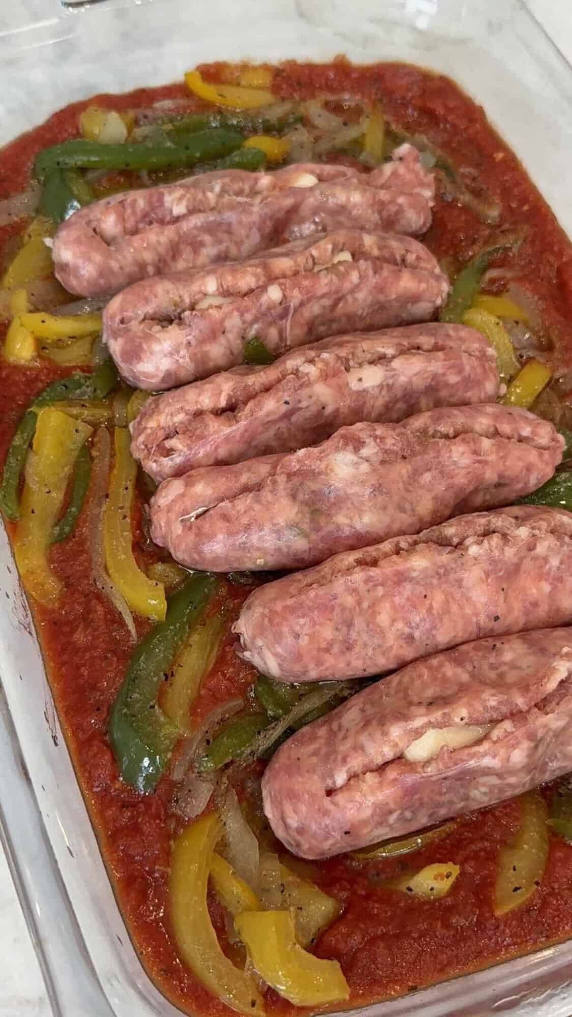 stuffed sausage with a mozzarella stick in a baking dish