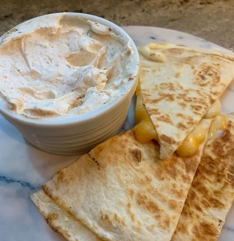 cheese quesadillas next to sauce