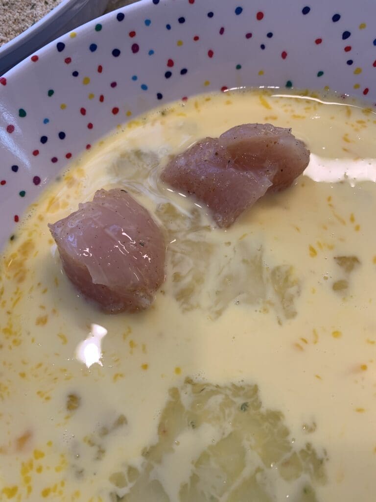 chicken dipped into the egg wash