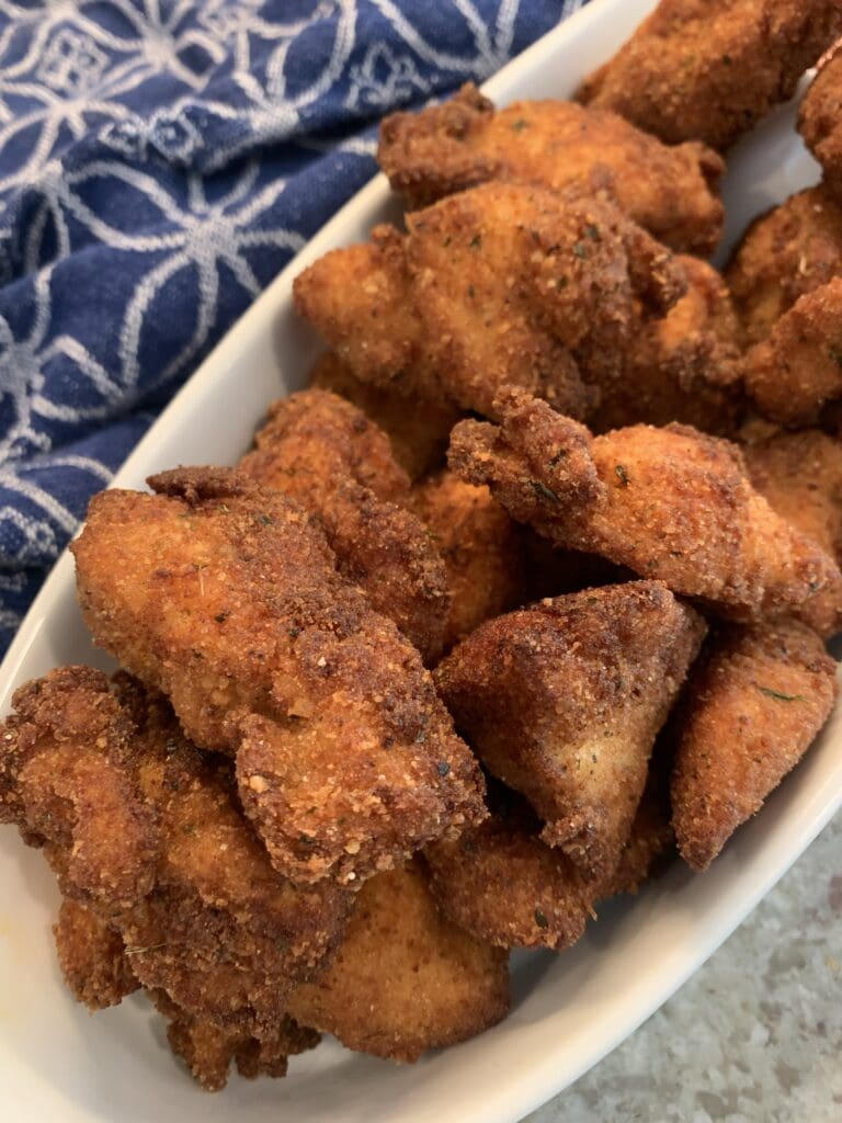 friend italian chicken nuggets in a serving dish