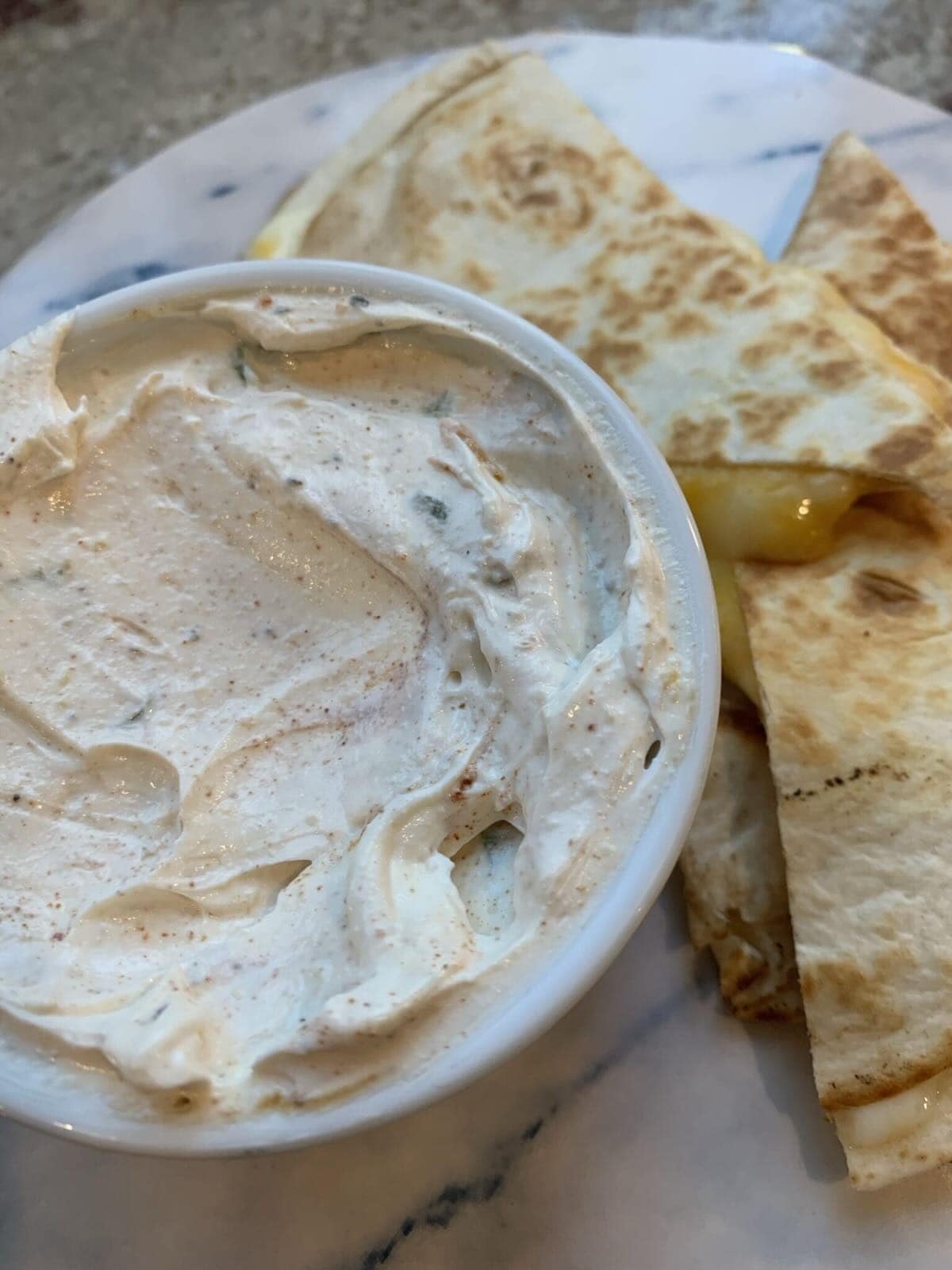 taco bell sauce next to a quesadilla