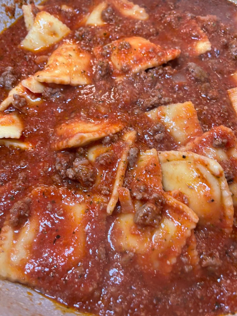 meat sauce on ravioli