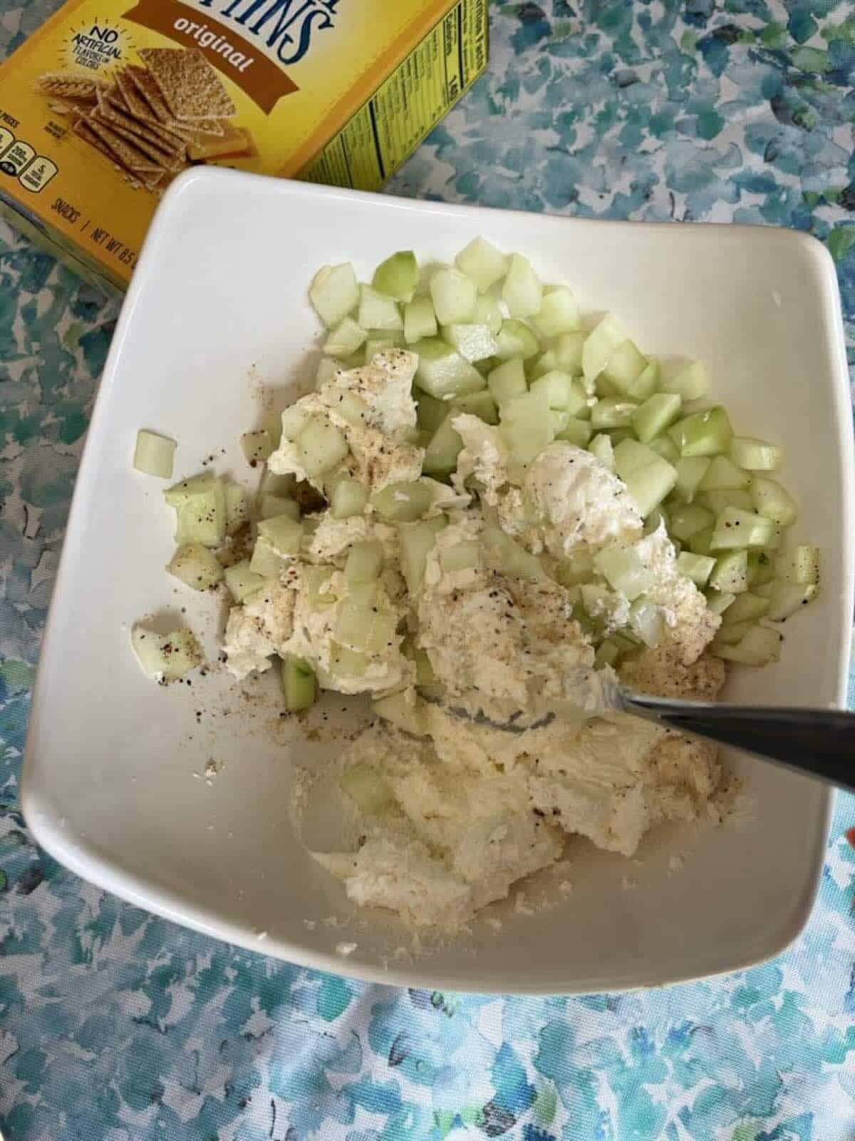 cucumbers, cream cheese and dry italian dressing in bowl