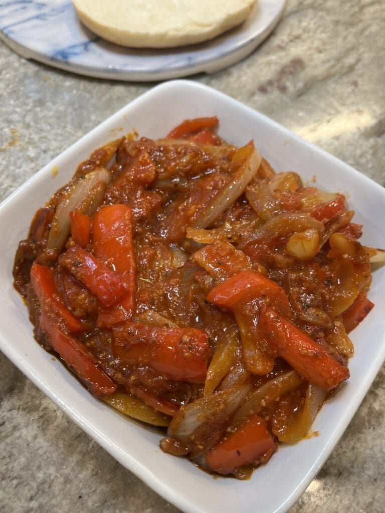 peppers and onions in a bowl kept warm