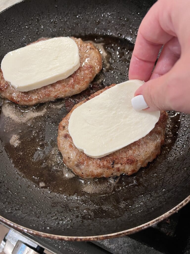 mozzarella cheese on sausage patties