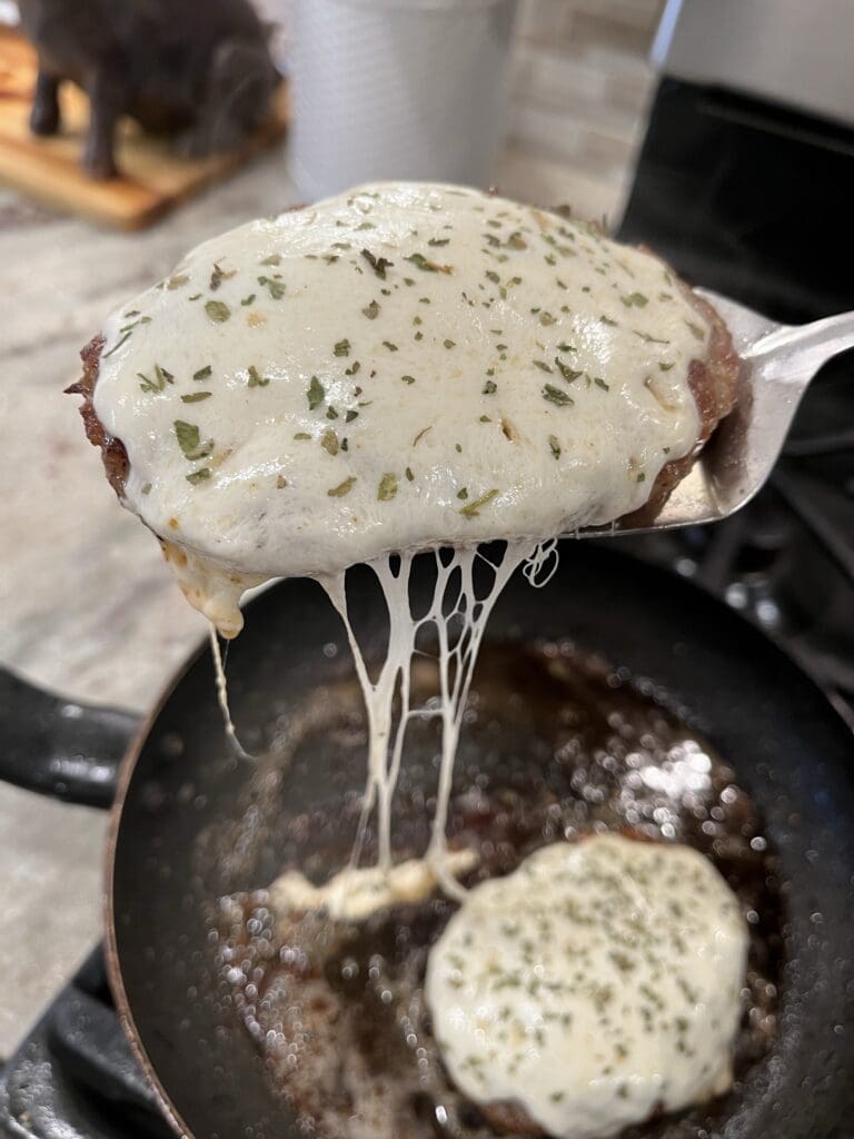 melted cheese on sausage