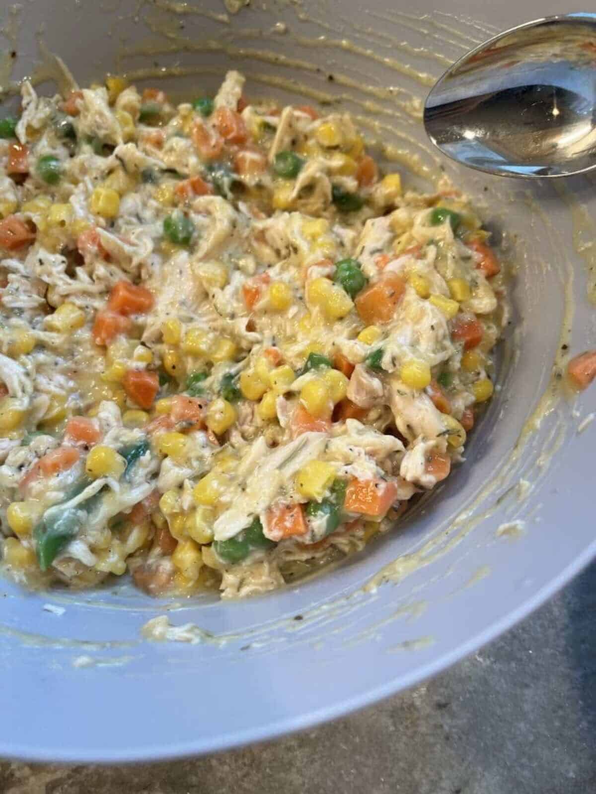 muffin tin chicken pot pie mixture in a bowl