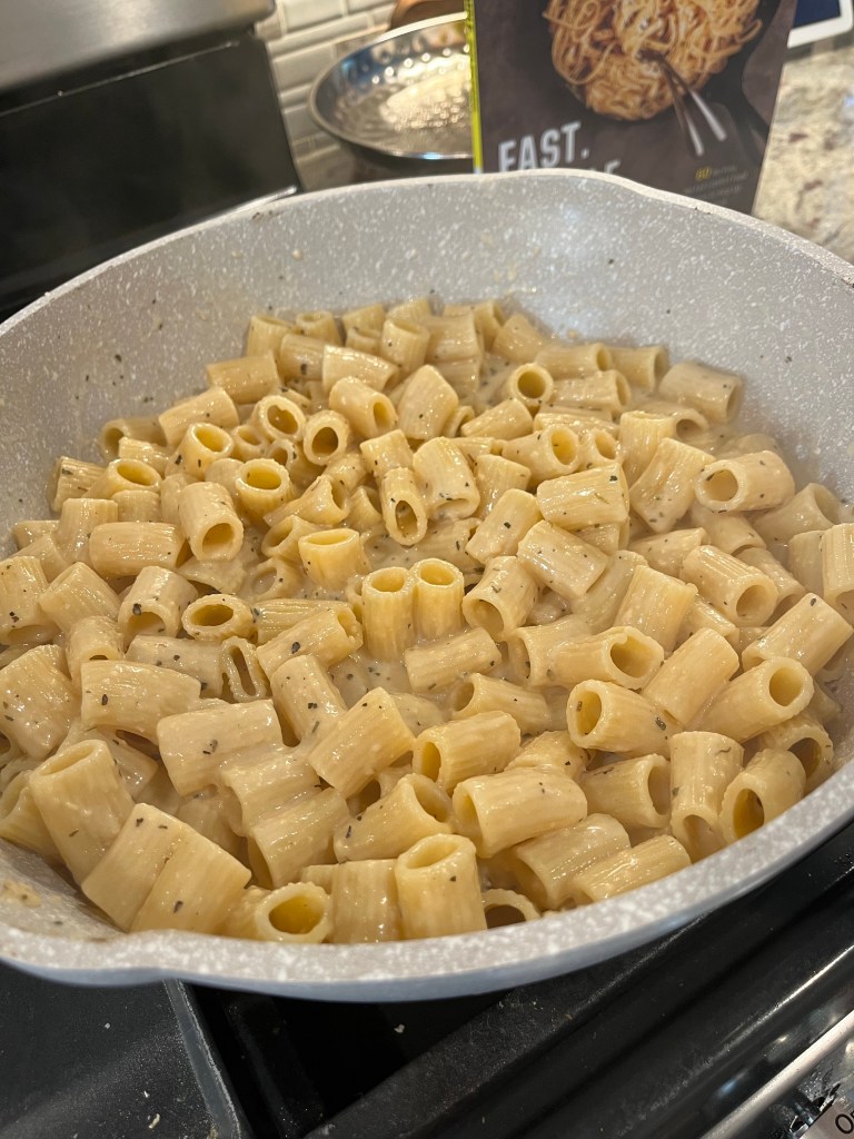 rigatoni pasta added to skillet
