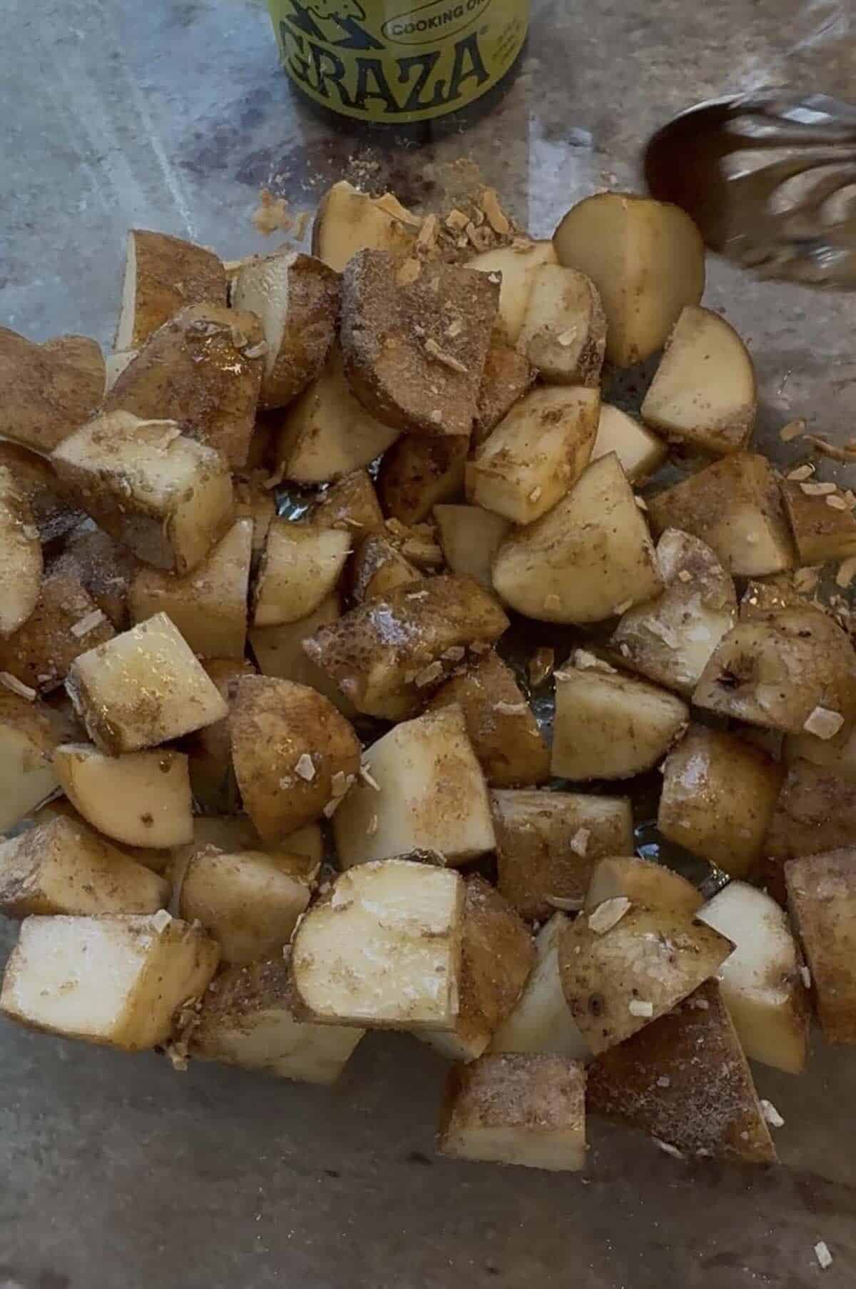 cut potatoes mixed with olive oil and onion soup packet