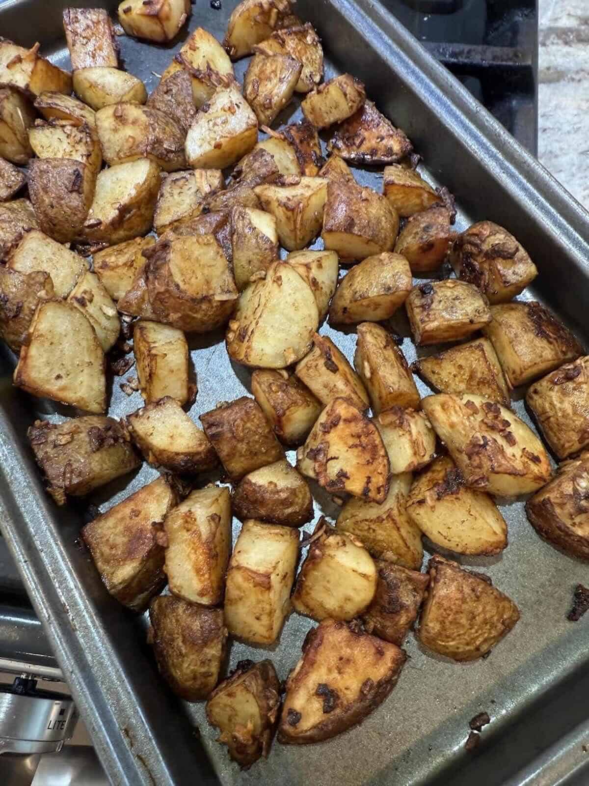 finished crispy potatoes on baking sheet