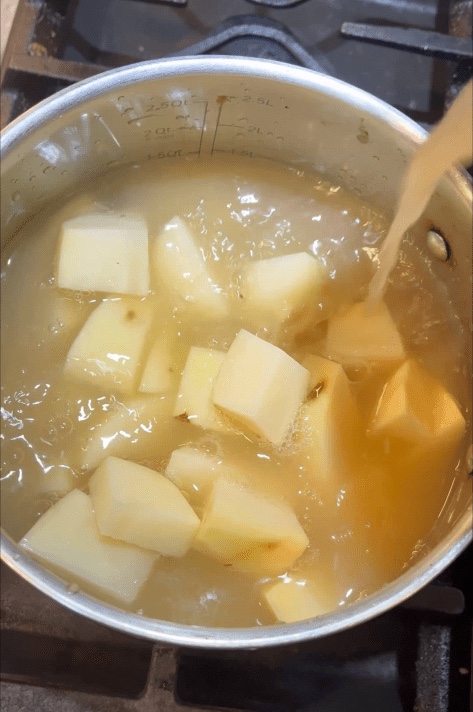 cubed potatoes in chicken broth