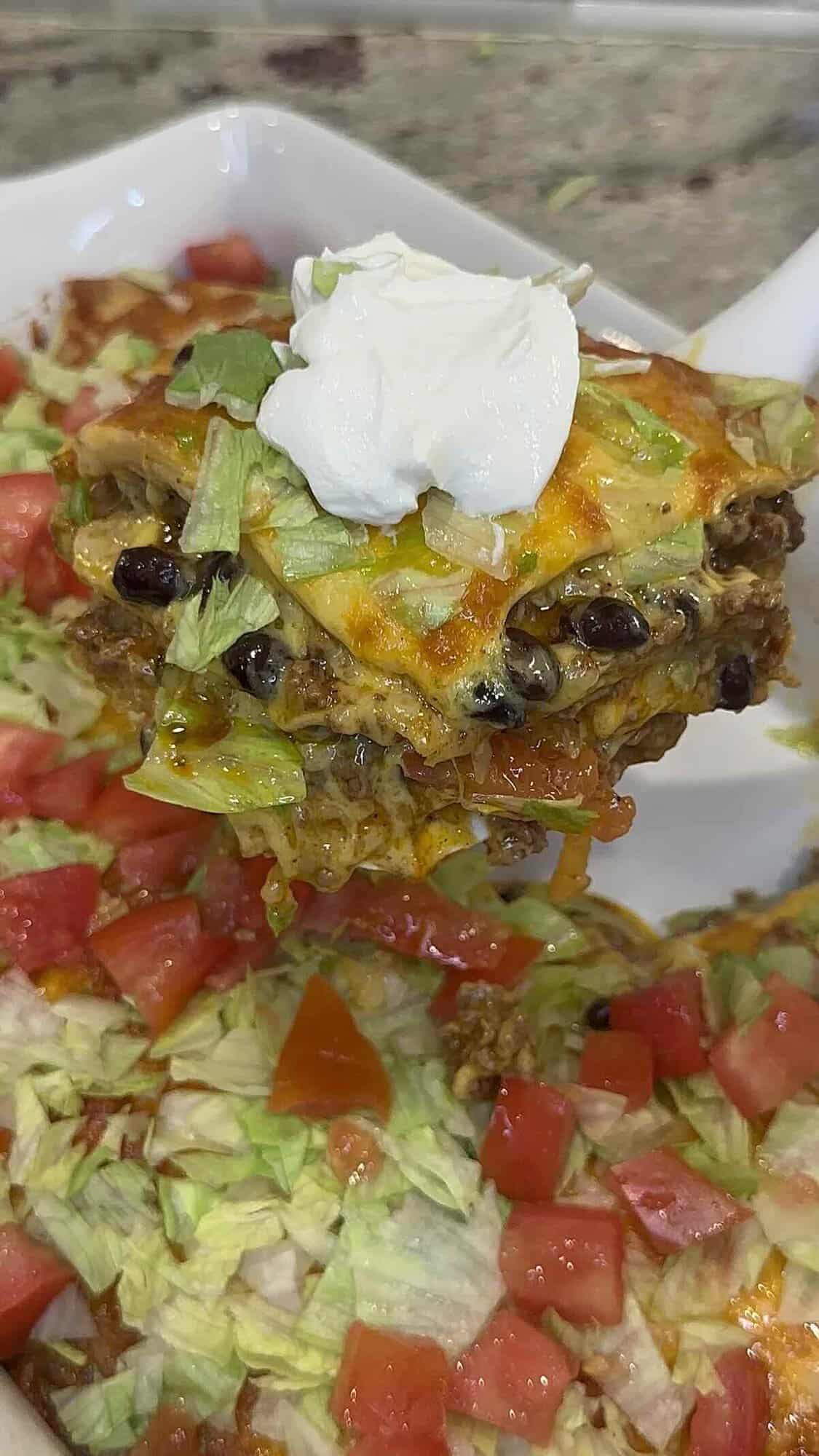 finished taco lasagna in baking dish