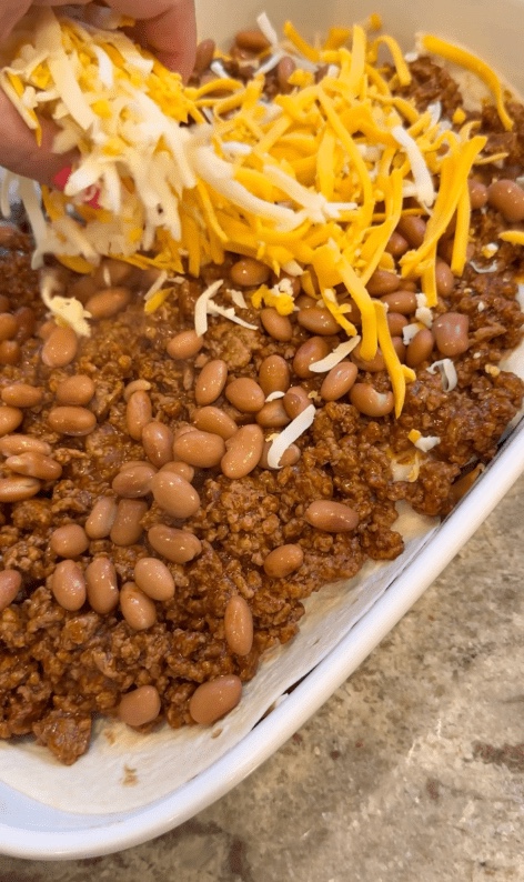 cheese over beans and taco meat