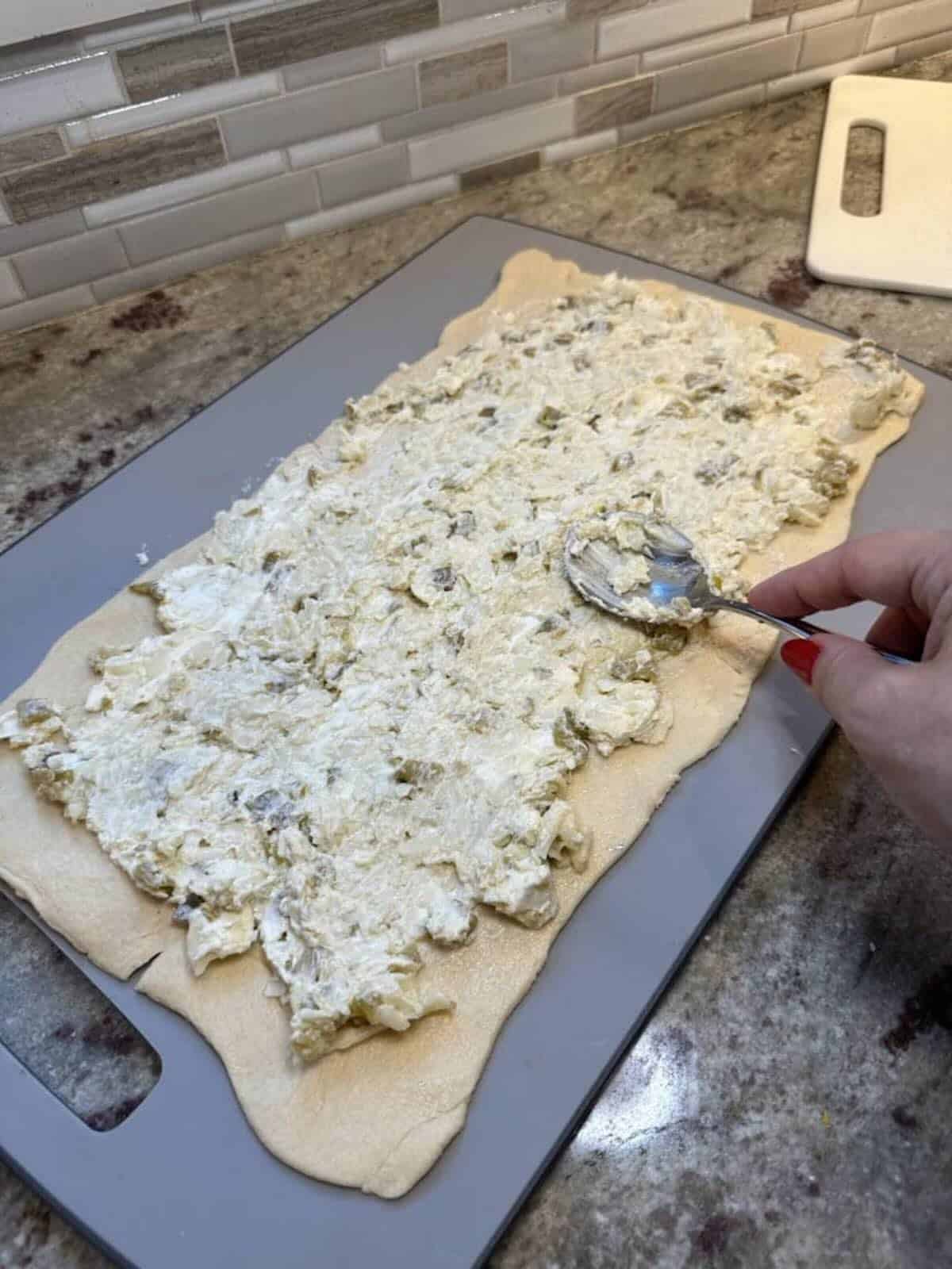 japapeno popper mix on top of cresent rolls