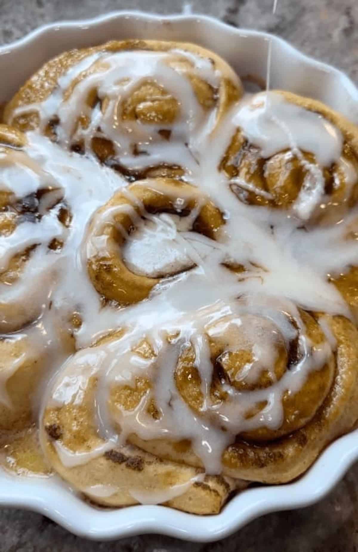 finished viral cinnamon rolls with icing on top