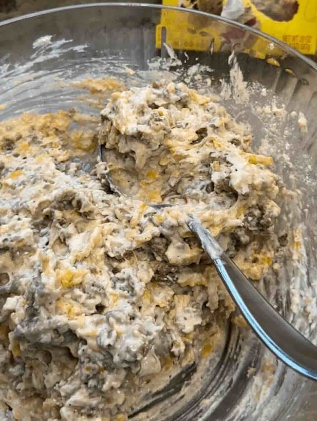 sausage bread ingredients mixed in a bowl
