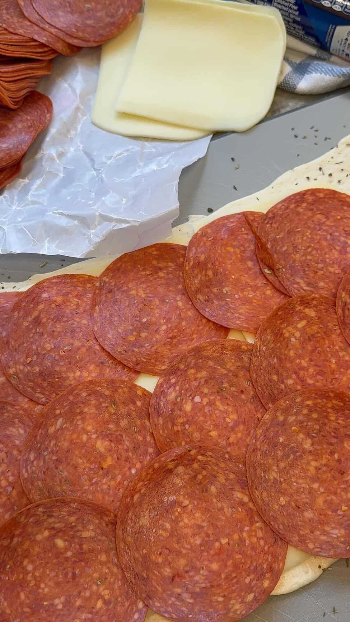 pizza dough, mozzarella cheese and pepperoni 