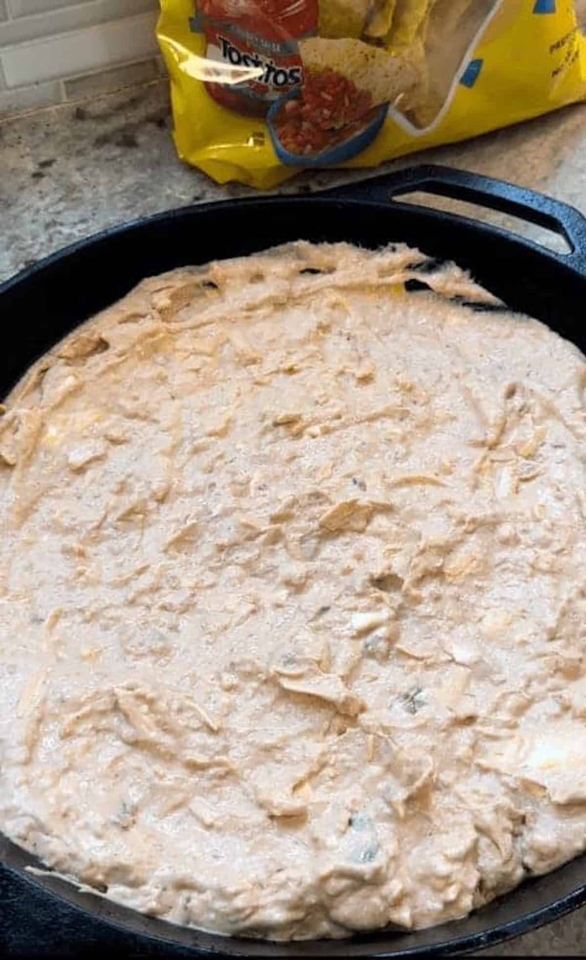 refried bean dip in cast iron skillet
