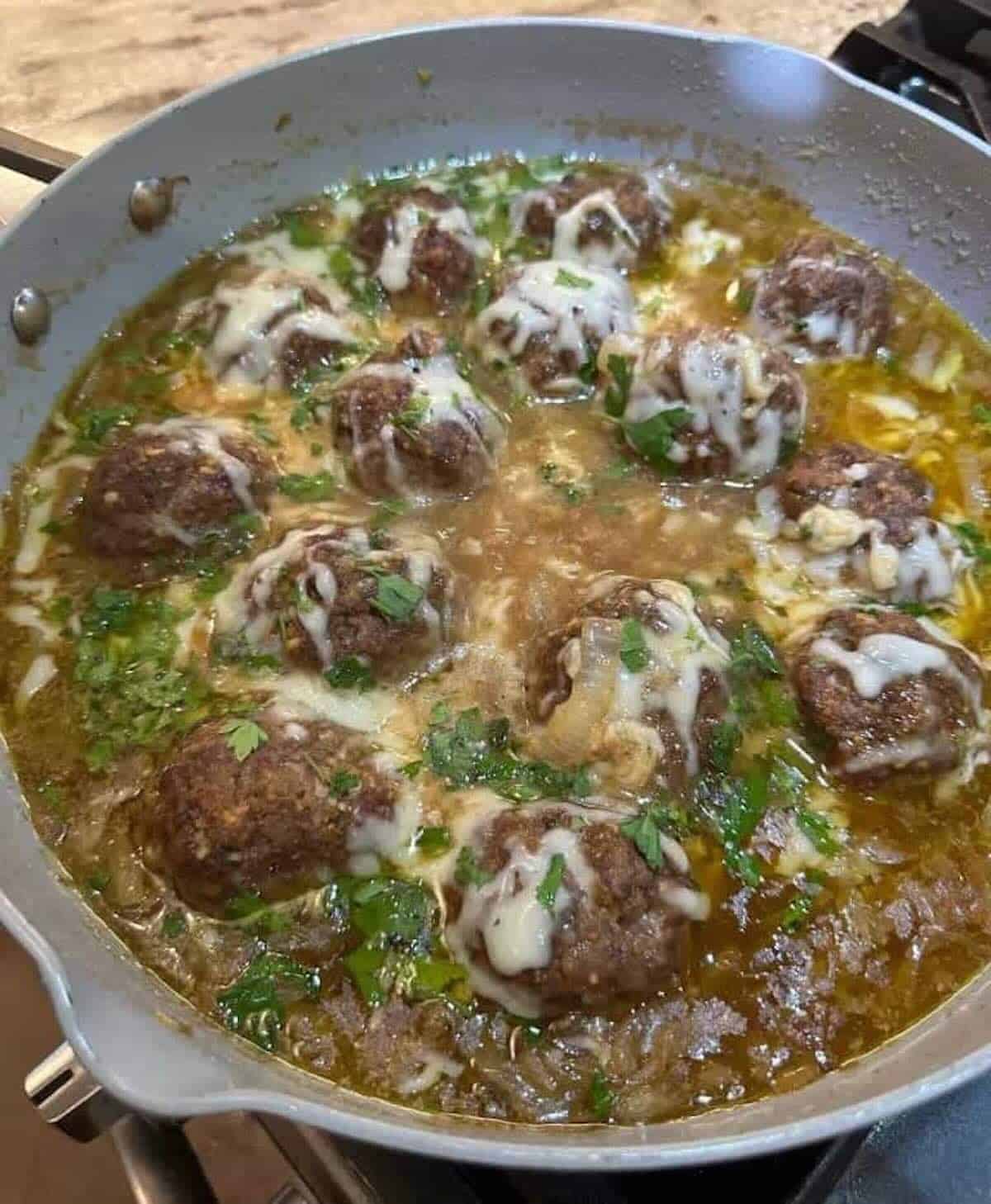 french onion meatballs in skillet