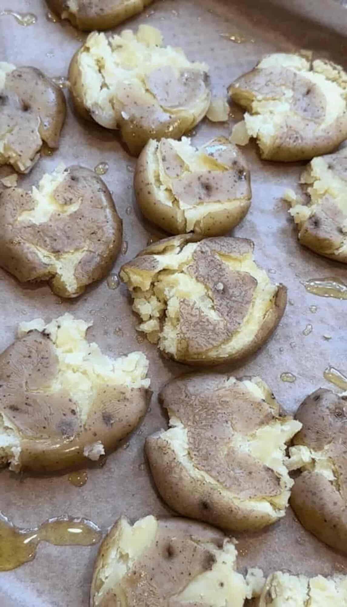 smashed potatoes on baking sheet