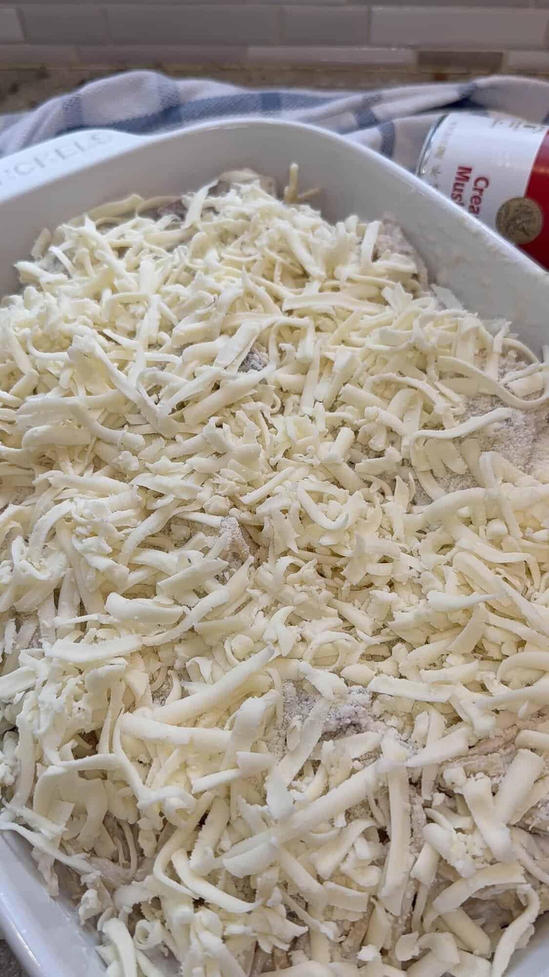 turkey tetrazzini in the baking dish with cheese on top