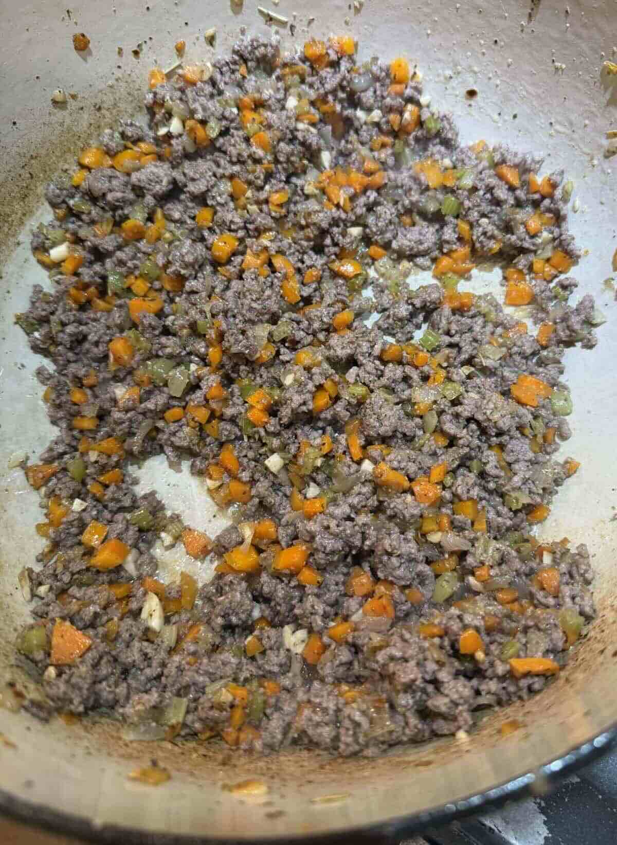 ground beef and vegetables in stock pot