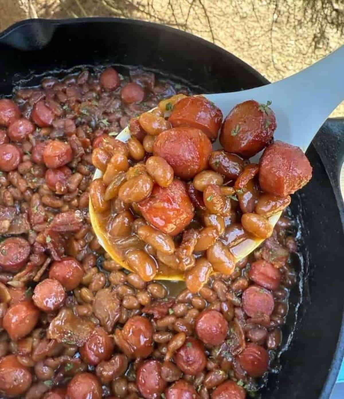 finished beans and wiens in cast iron skillet