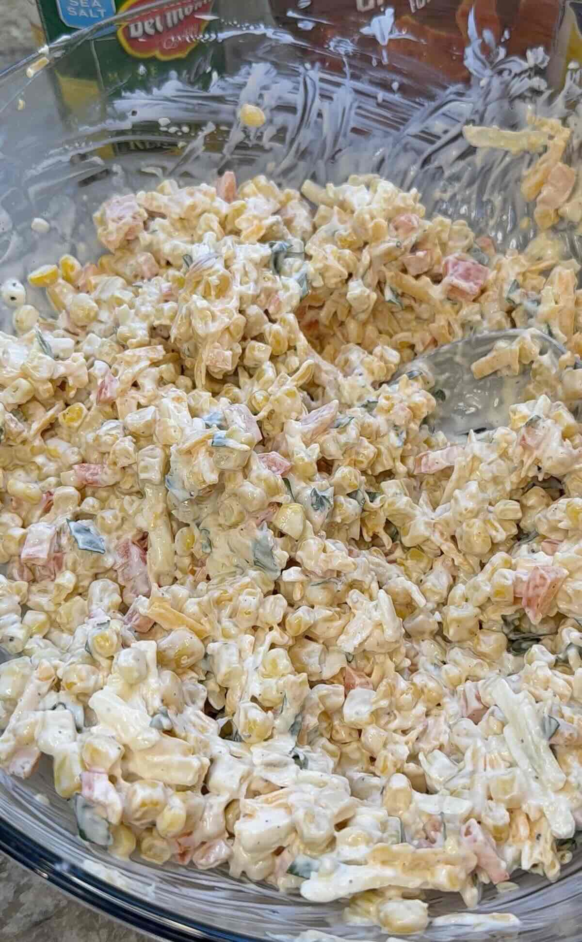 Frito corn salad ingredients in a bowl