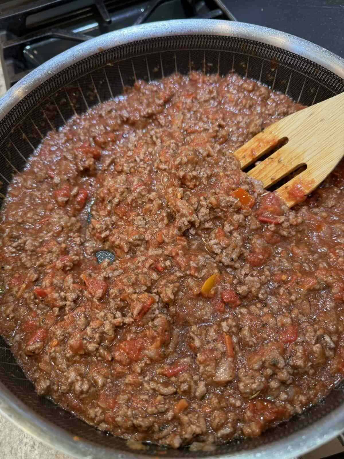 ground beef and tomato sauce in skillet