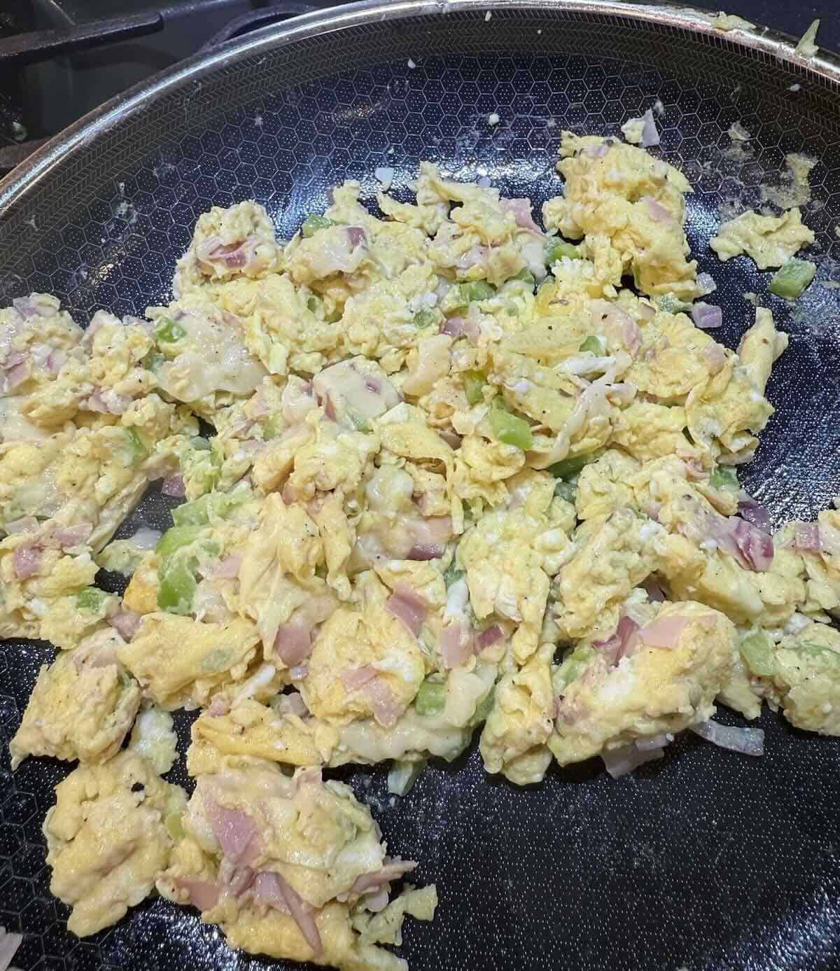 western style scrambled eggs in skillet 