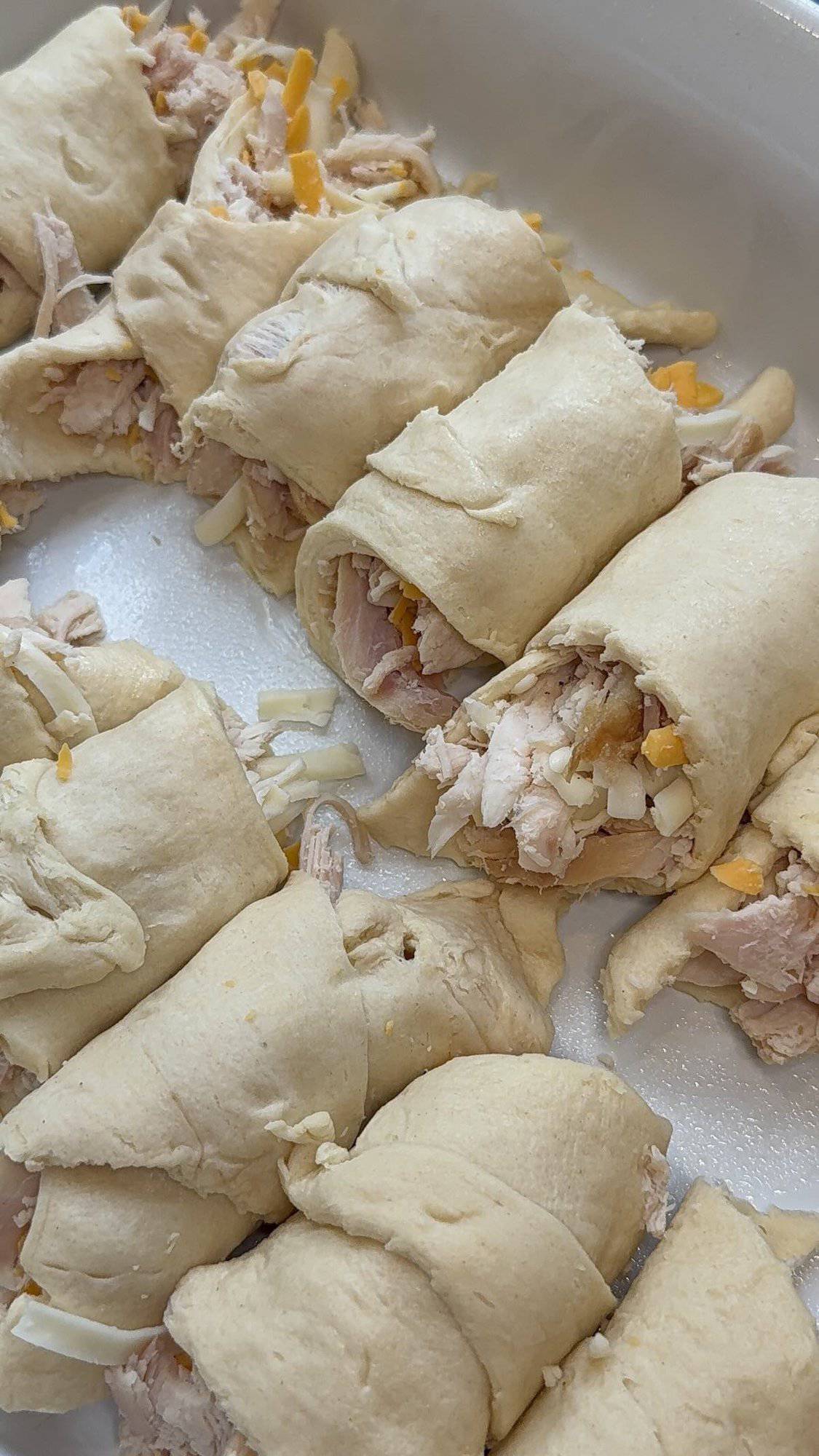 chicken and cheese stuffed crescent rolls in baking dish