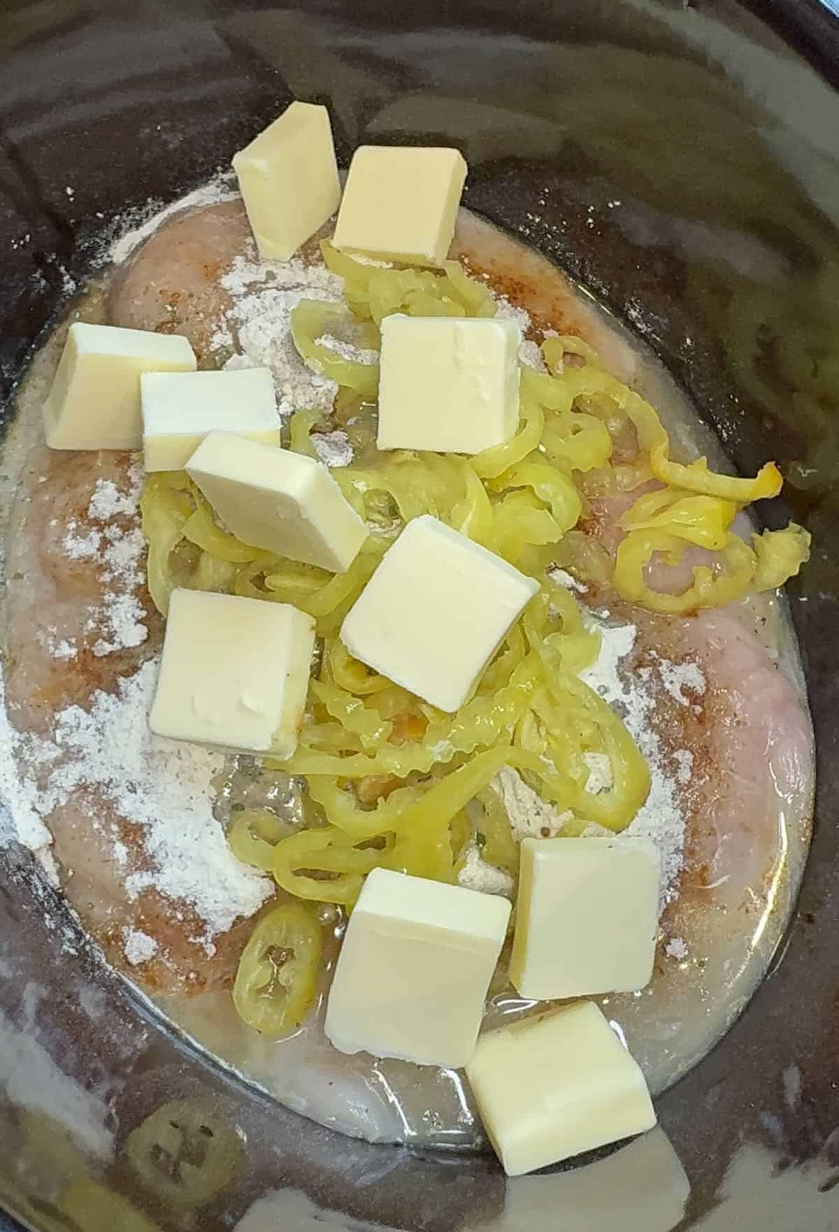 chicken breast, au jus, ranch seasoning, peperocini peppers in the crockpot